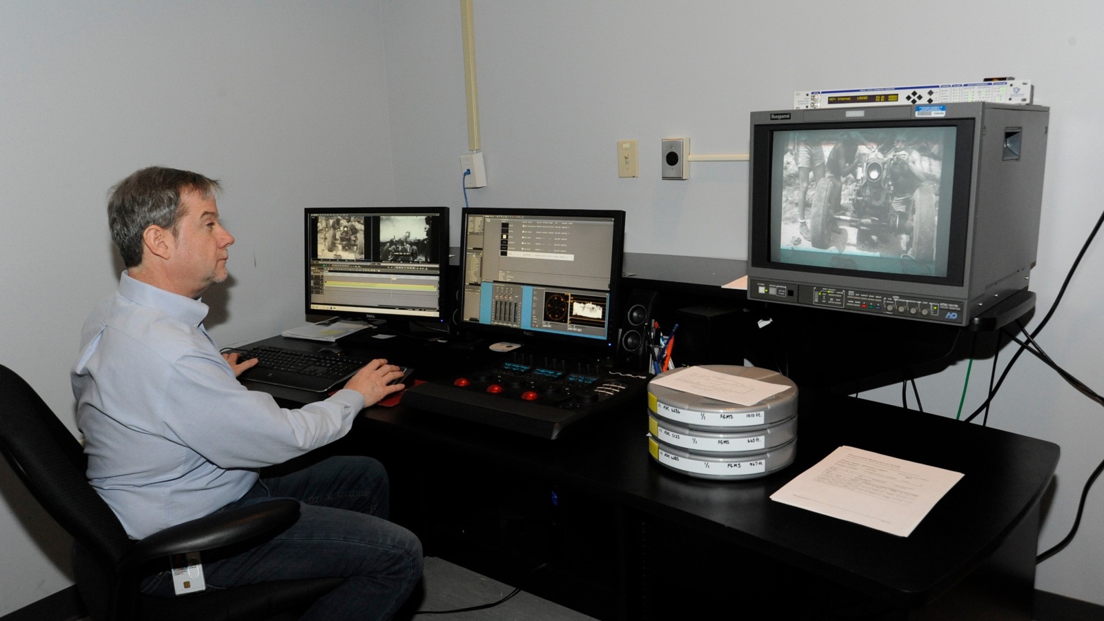 Harry Snodgrass using a non-linear editing system in the U.S. National Archives Motion Picture Preservation Lab