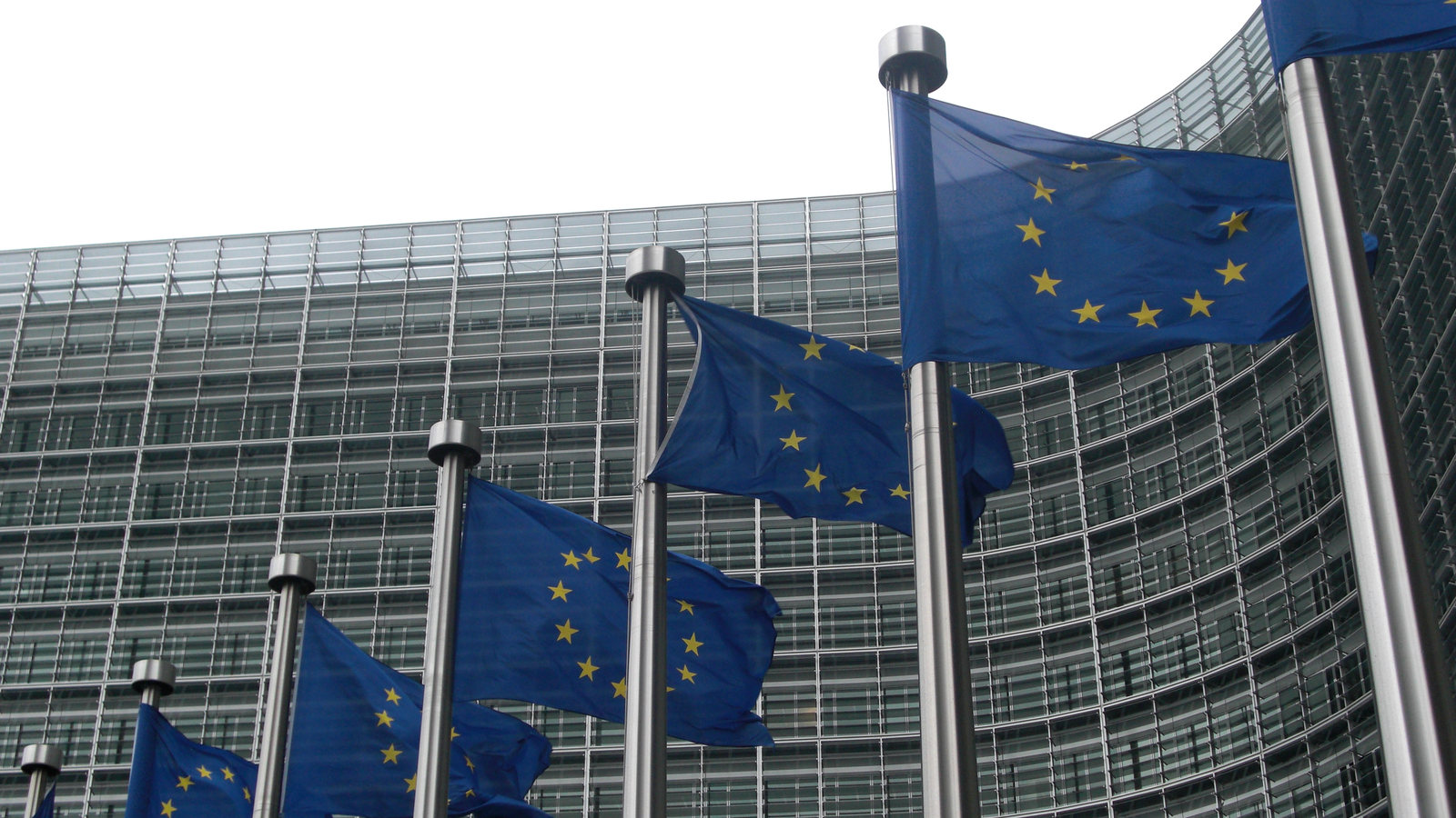 European Union flags outside a European Commission building