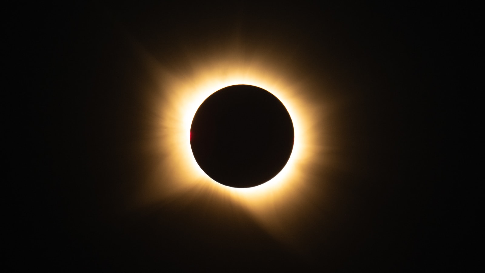The black disk of the Moon surrounded by the bright solar corona during the August 12, 2026 total eclipse